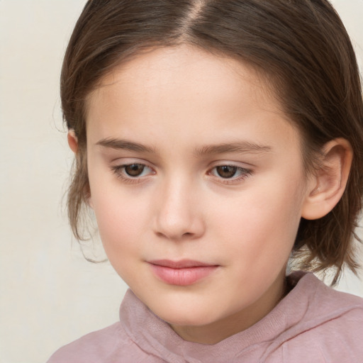 Joyful white child female with medium  brown hair and brown eyes