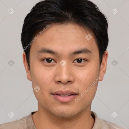 Joyful asian young-adult male with short  brown hair and brown eyes