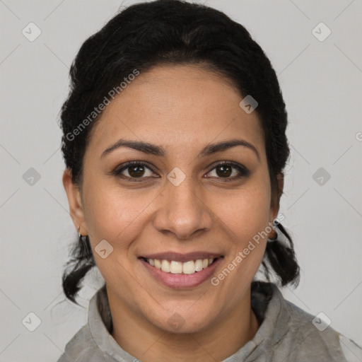 Joyful latino young-adult female with short  brown hair and brown eyes