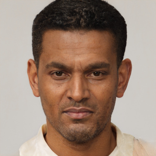 Neutral black adult male with short  brown hair and brown eyes