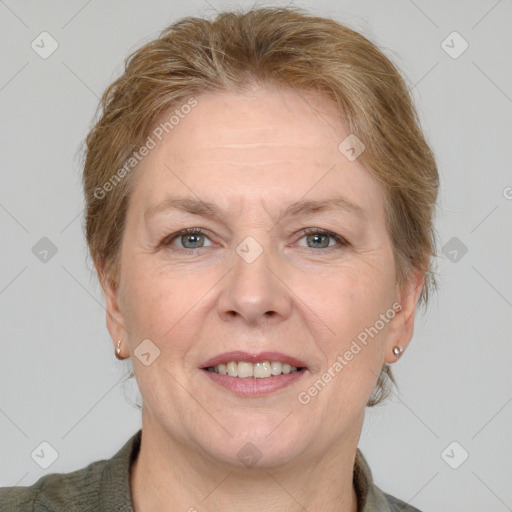 Joyful white adult female with medium  brown hair and grey eyes