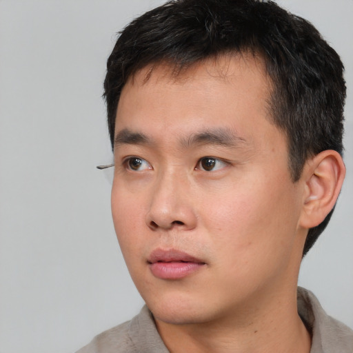 Neutral asian young-adult male with short  black hair and brown eyes