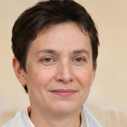 Joyful white adult female with short  brown hair and brown eyes