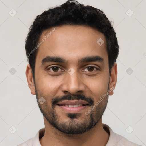 Joyful latino young-adult male with short  black hair and brown eyes