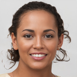 Joyful white young-adult female with medium  brown hair and brown eyes