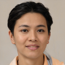 Joyful asian young-adult female with short  brown hair and brown eyes