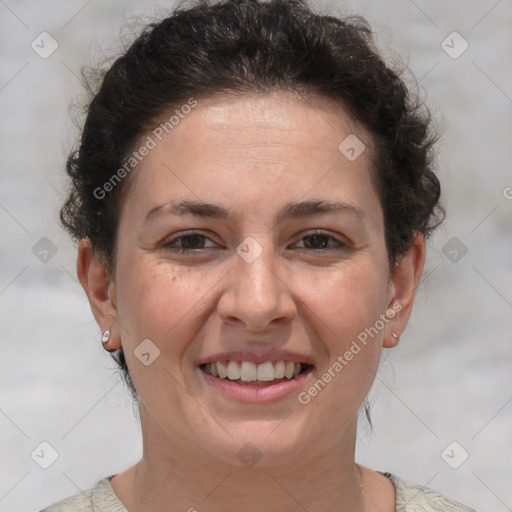 Joyful white adult female with short  brown hair and brown eyes