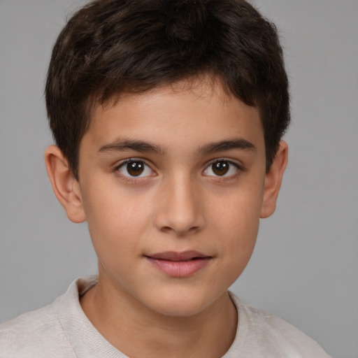 Joyful white child male with short  brown hair and brown eyes