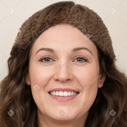 Joyful white young-adult female with long  brown hair and green eyes