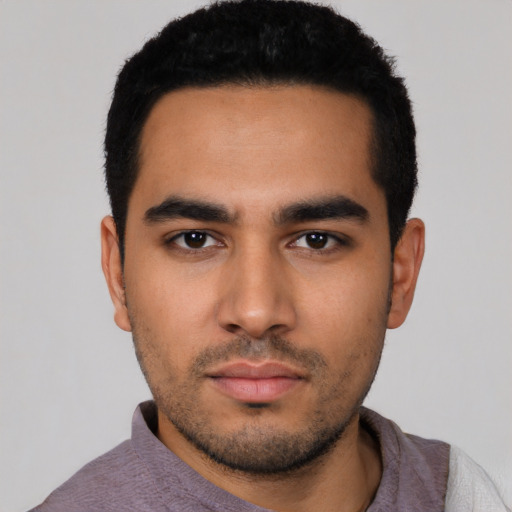 Neutral latino young-adult male with short  black hair and brown eyes