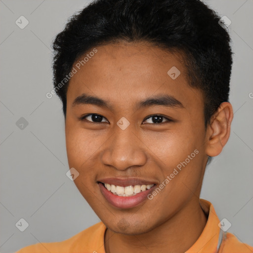 Joyful latino young-adult male with short  brown hair and brown eyes