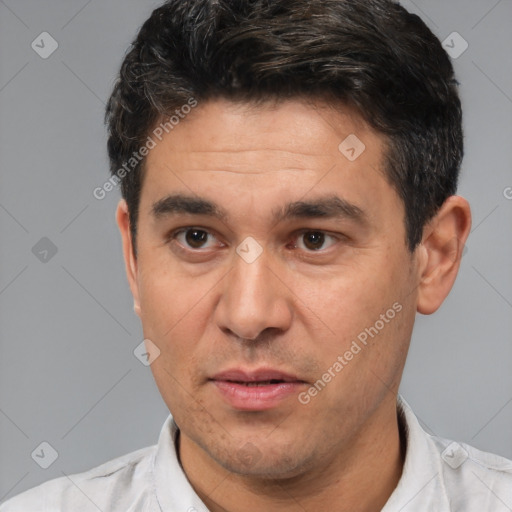 Joyful white adult male with short  black hair and brown eyes