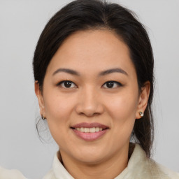 Joyful asian young-adult female with medium  brown hair and brown eyes