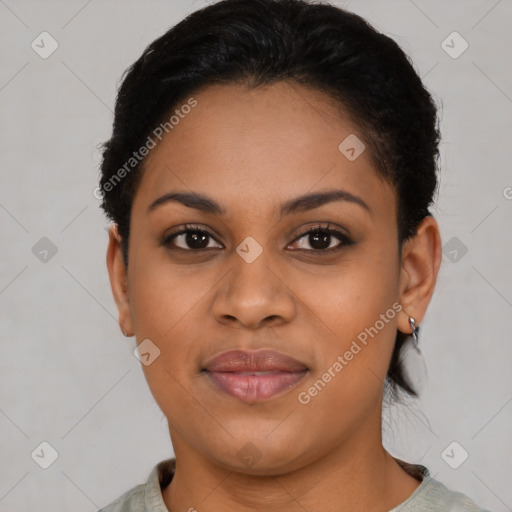 Joyful black young-adult female with short  brown hair and brown eyes