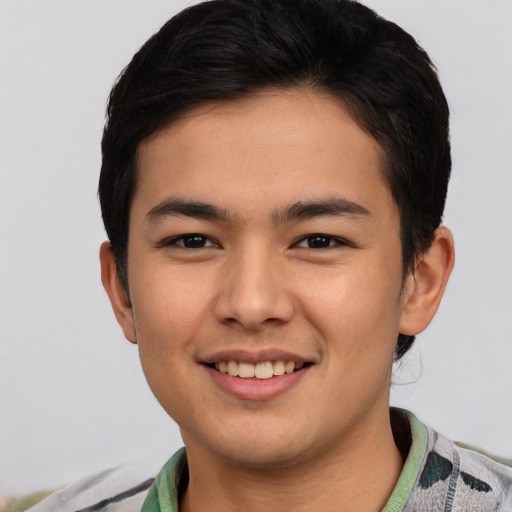 Joyful asian young-adult male with short  brown hair and brown eyes