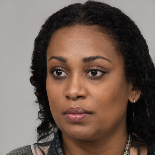 Neutral black young-adult female with medium  black hair and brown eyes