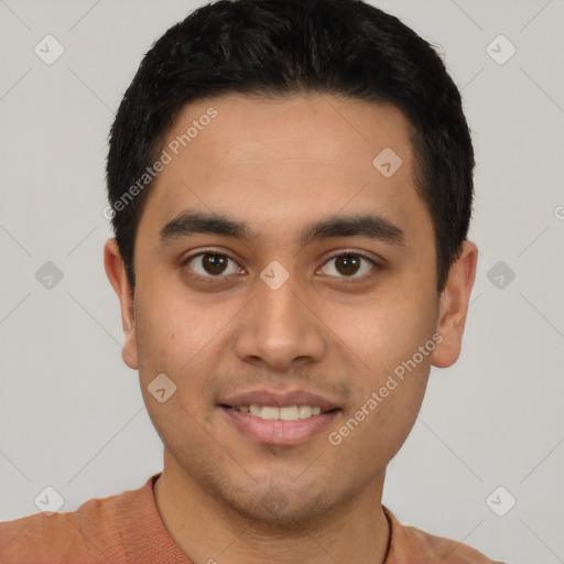 Joyful latino young-adult male with short  black hair and brown eyes