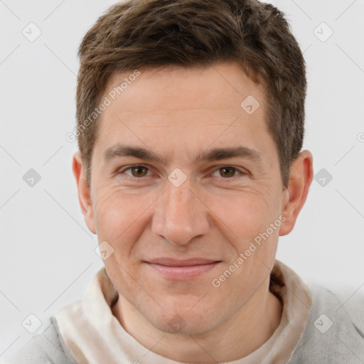 Joyful white adult male with short  brown hair and brown eyes