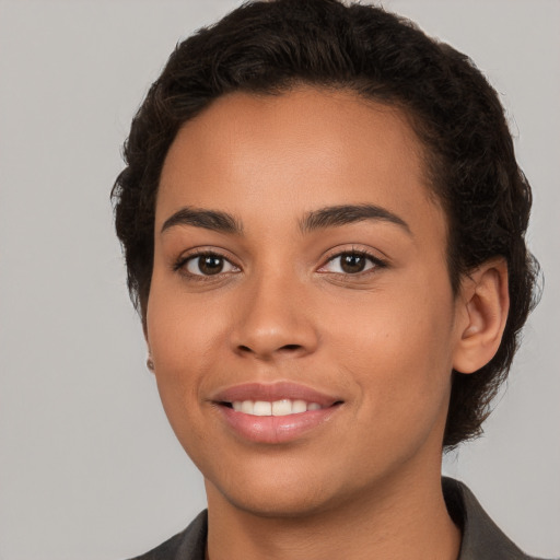 Joyful white young-adult female with short  brown hair and brown eyes