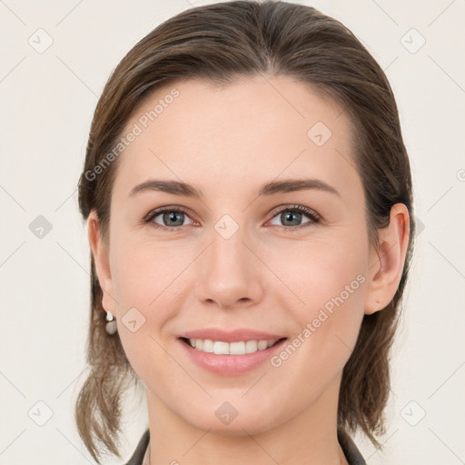 Joyful white young-adult female with medium  brown hair and grey eyes