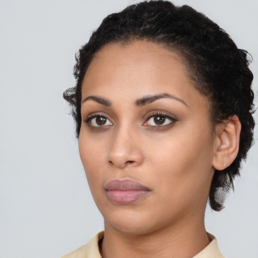 Neutral white young-adult female with short  black hair and brown eyes