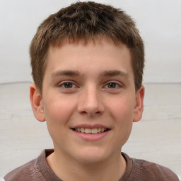 Joyful white child male with short  brown hair and brown eyes