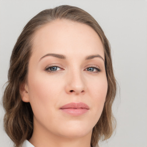 Neutral white young-adult female with medium  brown hair and grey eyes