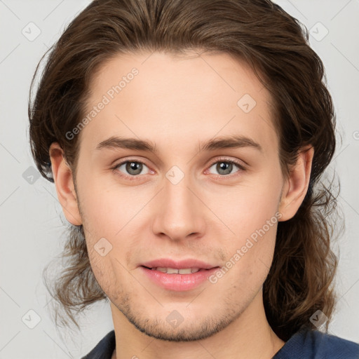 Joyful white young-adult male with medium  brown hair and brown eyes