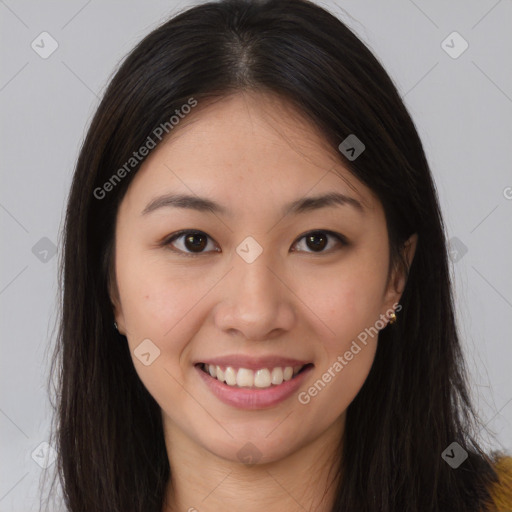 Joyful asian young-adult female with long  brown hair and brown eyes