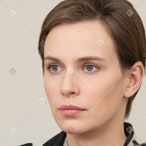 Neutral white young-adult female with short  brown hair and brown eyes