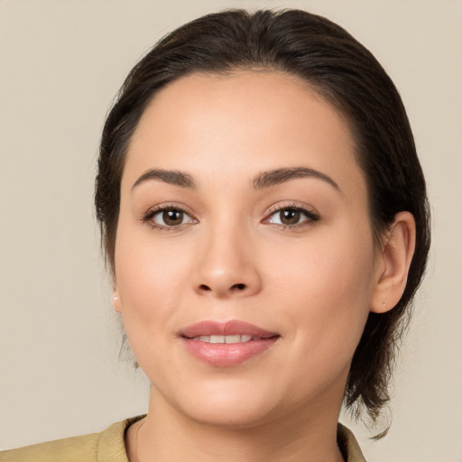 Joyful white young-adult female with medium  brown hair and brown eyes