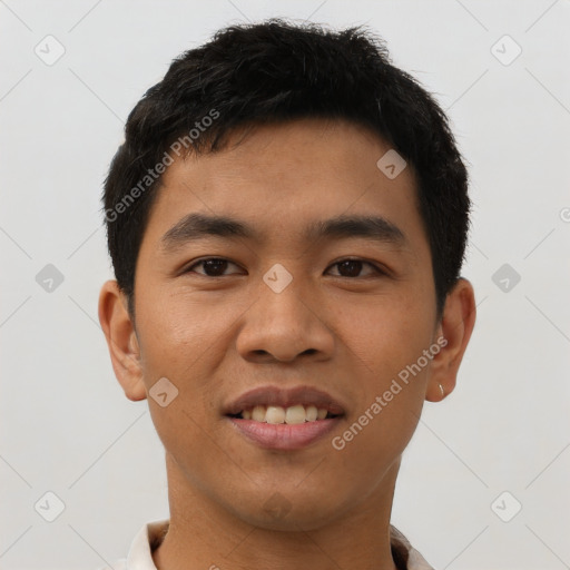 Joyful asian young-adult male with short  black hair and brown eyes