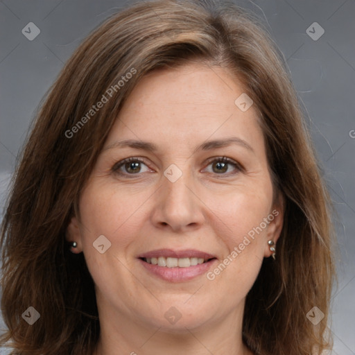 Joyful white adult female with medium  brown hair and brown eyes