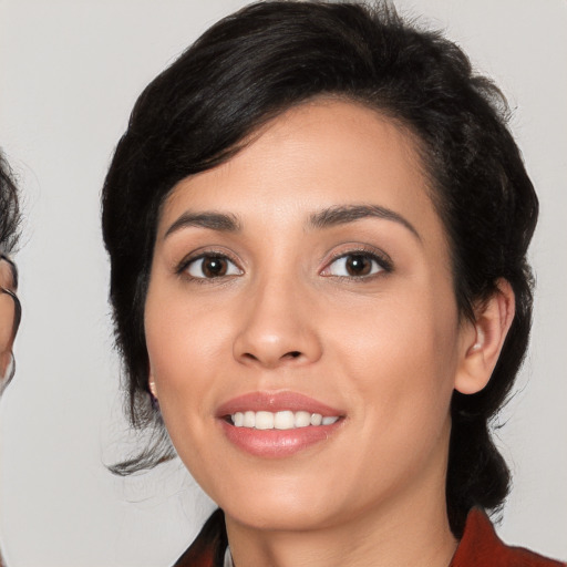 Joyful white young-adult female with medium  black hair and brown eyes