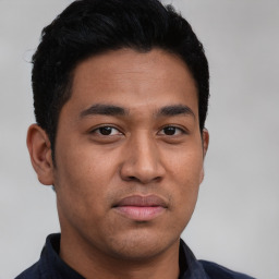 Neutral latino young-adult male with short  brown hair and brown eyes