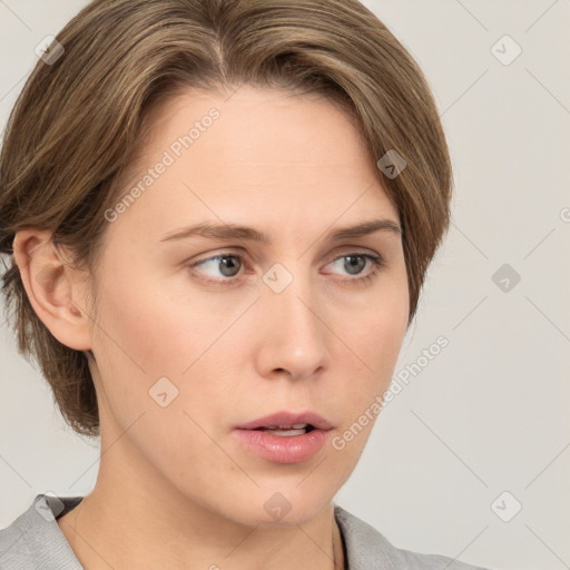 Neutral white young-adult female with medium  brown hair and grey eyes