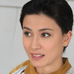 Joyful asian young-adult female with short  brown hair and brown eyes