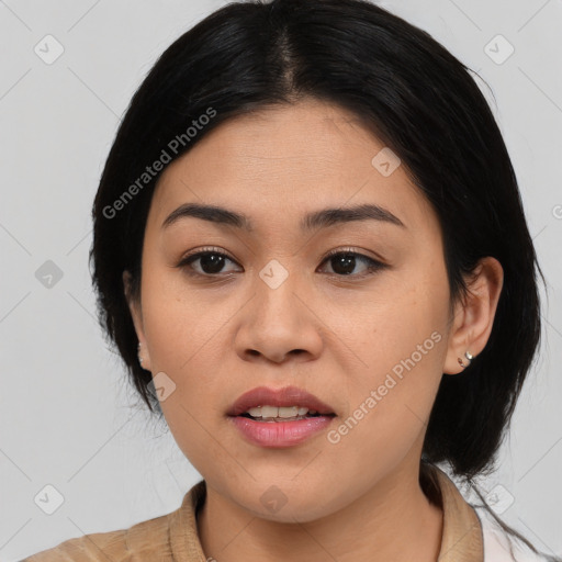 Joyful asian young-adult female with medium  black hair and brown eyes