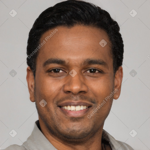 Joyful latino young-adult male with short  black hair and brown eyes