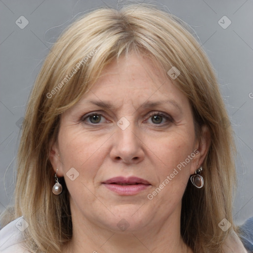 Joyful white adult female with medium  brown hair and grey eyes