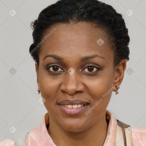 Joyful black adult female with short  brown hair and brown eyes