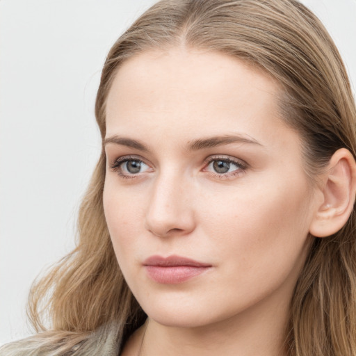 Neutral white young-adult female with long  brown hair and blue eyes