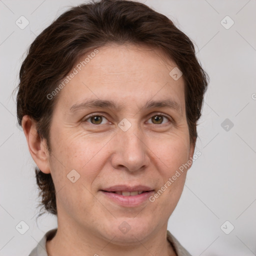 Joyful white adult female with short  brown hair and grey eyes