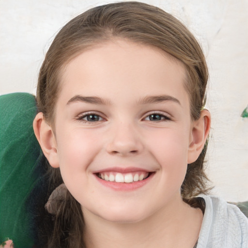 Joyful white child female with medium  brown hair and grey eyes