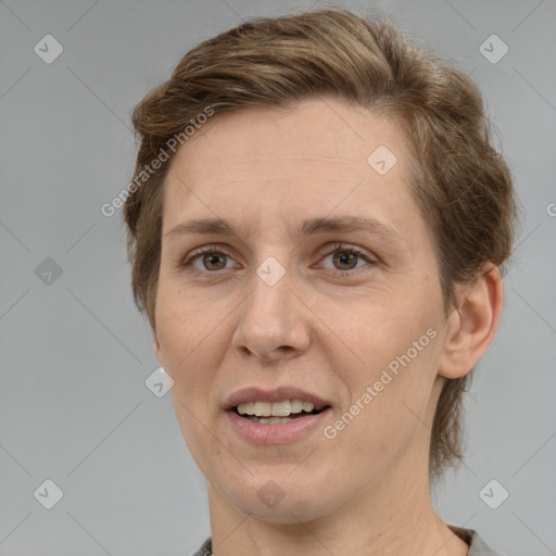 Joyful white adult female with medium  brown hair and grey eyes