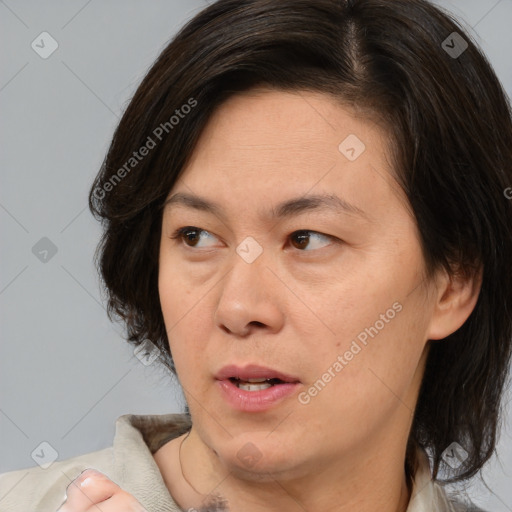 Joyful white adult female with medium  brown hair and brown eyes