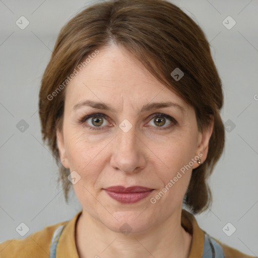 Joyful white adult female with medium  brown hair and grey eyes