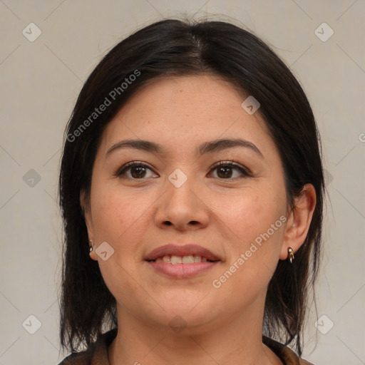 Joyful latino young-adult female with medium  brown hair and brown eyes