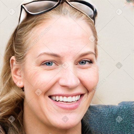 Joyful white young-adult female with medium  brown hair and blue eyes