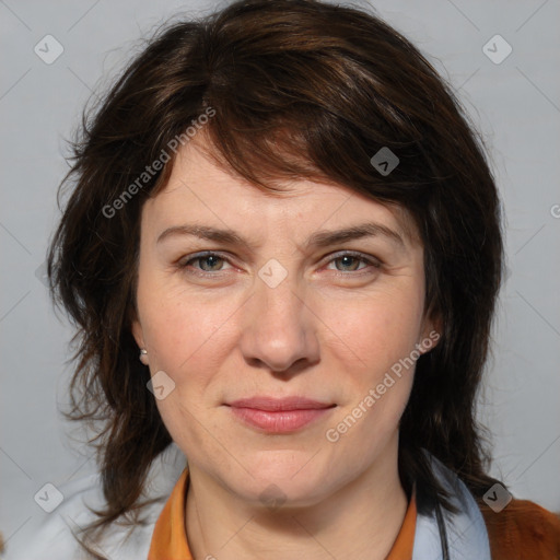 Joyful white adult female with medium  brown hair and brown eyes